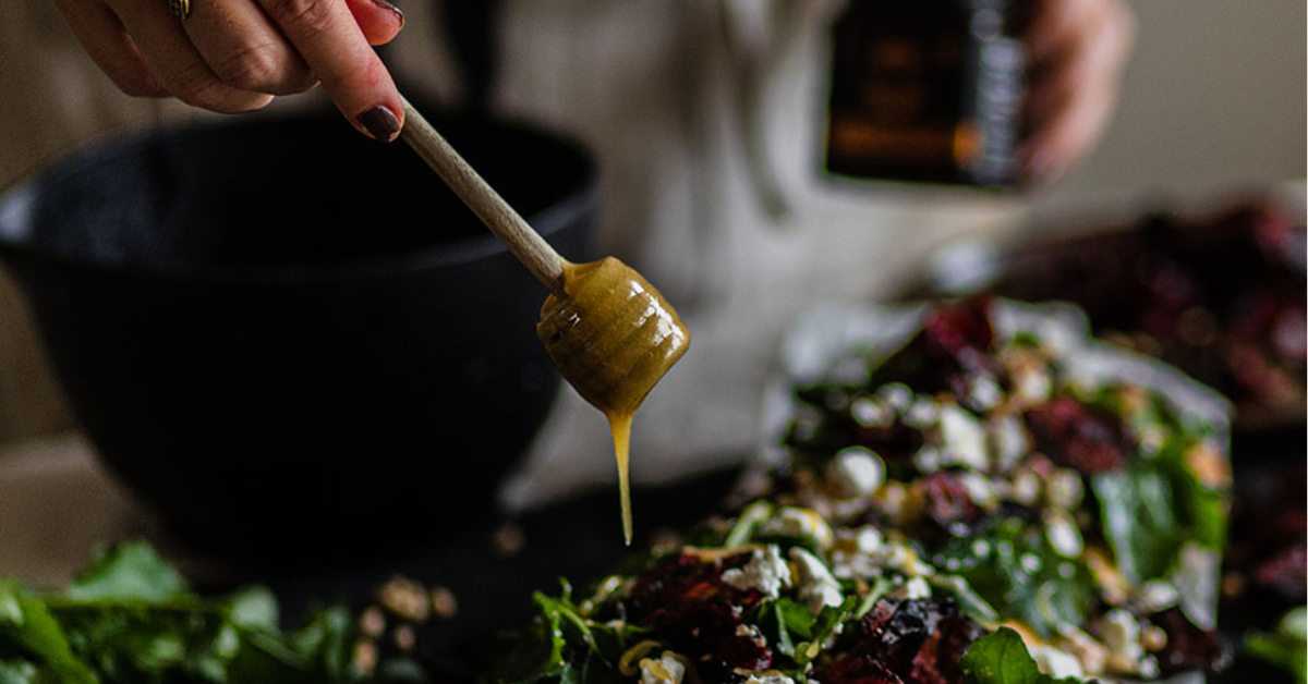 Pure Manuka Honey drizzled over food by a chef